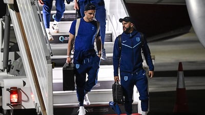 England defender Kyle Walker (R) and midfielder Jack Grealish arrive at the Hamad International Airport in Doha. AFP
