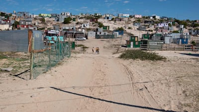 Shanty housing in Khayelitsha, near Cape Town, South Africa. Elevating the UK minister for development and Africa to cabinet level was one feature of the departmental merger. AFP