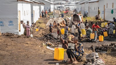 People displaced by the fighting between Congolese forces and M23 rebels gather in a camp near Goma, Democratic Republic of Congo, AP