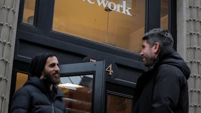 People stand outside a WeWork co-working space in New York City. Reuters.