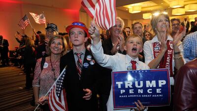 Supporters of Republican presidential nominee Donald Trump celebrate after Trump was declared as the winner of the US election. Jason Connolly / AFP
