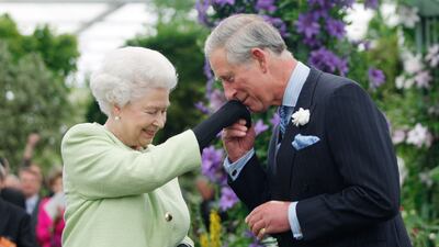 Queen Elizabeth presents her son Prince Charles with the Royal Horticultural Society's Victoria Medal of Honour at the 2009 show. Getty Images