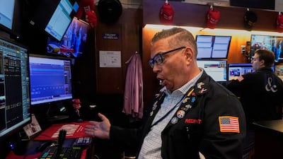 A trader on the floor of the New York Stock Exchange. Wall Street's indices closed this week with gains of about 1 per cent. AP