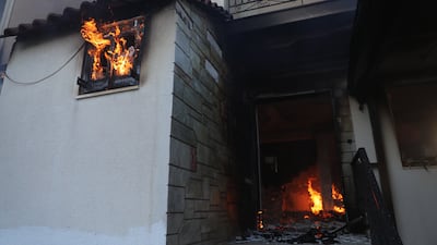 This house caught alight during a wildfire in Megara, Greece. EPA