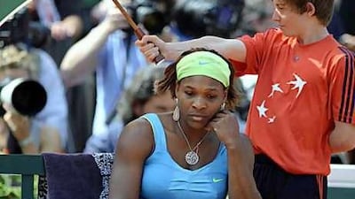 Serena Williams gets that sinking feeling during her defeat to Samatha Stosur yesterday.