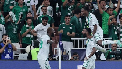 Feras Al Brikan of Al Ahli celebrates scoring his team's first goal with teammates. Getty Images