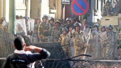 Troops and protesters clashed for the third straight day in Cairo, pelting each other with rocks in skirmishes near Tahrir Square. Ahmed Ali / AP Photo