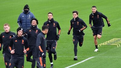 Juventus' forward Paulo Dybala, Cristiano Ronaldo and teammates at the Continassa training ground. AFP