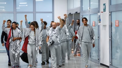 Italian activists from the Gaza-bound Global Sumud Flotilla arrive at the airport in Fiumicino, Italy, on Thursday after being released by Israel. Reuters