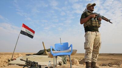 An Iraqi soldier stands guard near the Iraqi city of Qaim at the Iraqi-Syrian border. AFP