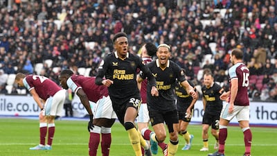 Newcastle United's English midfielder Joe Willock, centre, celebrates after scoring against West Ham. AFP