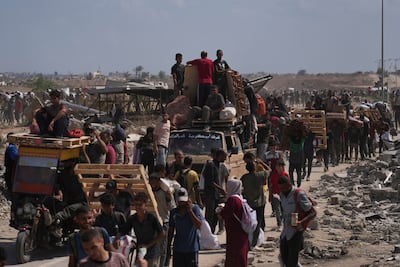 Gazans have been forced to collect limited food supplies in often dangerous situations. AP