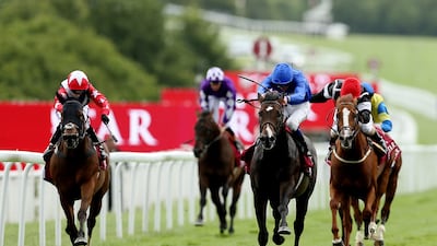 Godolphin jockey James Doyle, second from right, rides Toormore to victory in the Lennox Stakes on Tuesday at Goodwood. Matthew Childs / Reuters