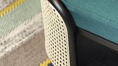 The retro aesthetic extends to the rugs and chairs. Courtesy Ammar Basheir