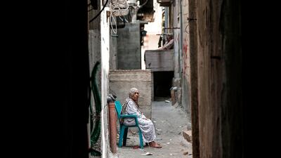 A Palestinian refugee sits in a street of the Al-Shati refugee camp in Gaza City. AFP