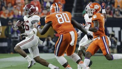Alabama's Marlon Humphrey, left, catches an onside kick during the second half of the NCAA college football playoff championship game against Clemson Monday, Jan. 11, 2016, in Glendale, Ariz. (AP Photo/David J. Phillip)