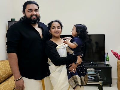 Dona with her husband and daughter at their new Abu Dhabi home. Dona Cheriyan / The National