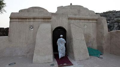 Hafiz Ahmed, imam of Al Bidiya mosque, going inside the mosque in Fujairah. Pawan Singh / The National