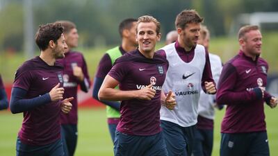Tottenham Hotspur teammates Ryan Mason and Harry Kane warm up during the England training session at St Georges Park on Wednesday. Alex Livesey / Getty Images