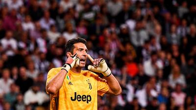 Juventus' goalkeeper Gianluigi Buffon gestures to his teammates. AFP