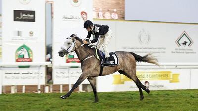 AF Sajanjle is ridden home by jockey Richard Mullen at the Abu Dhabi Equestrian Club on Sunday. Courtesy Andrew Watkins / Dubai Racing Club