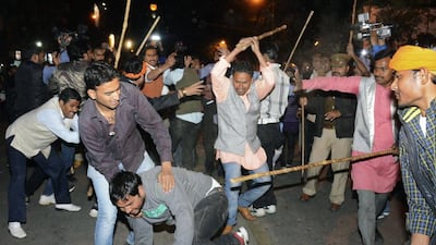 Supporters of the AAP and BJP clash during a protest outside the office of BJP in the northern Indian city of Lucknow on March 5, 2014. Reuters