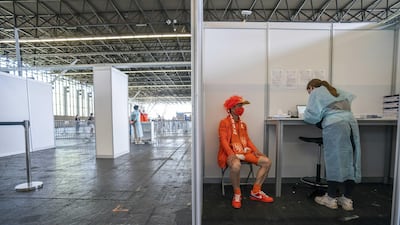 A Netherlands' fan gets tested before the UEFA EURO match between the Netherlands and Ukraine in the RAI convention centre in Amsterdam. EPA