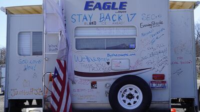 Comments of support and well wishes scrawled on a recreational vehicle parked at People's Convoy in Hagerstown, Maryland.