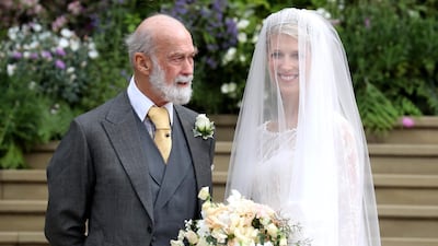 Lady Gabriella Windsor poses with her father, Prince Michael of Kent, before her wedding ceremony to Thomas Kingston at St George's Chapel in Windsor Castle, on May 18, 2019. AFP