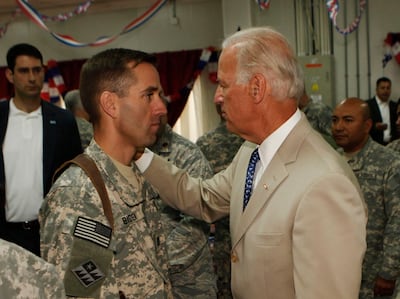 Joe Biden in 2011 with his son, US Army Capt Beau Biden, who died from a cancer-related illness. AFP