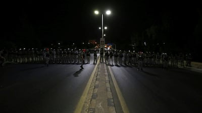 Jordanian police officers secure the office of the prime minister during a demonstration in the capital Amman late on Sunday. AFP/Khalil MAZRAAWI