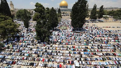 Palestinian Muslims pray before the Noble Sanctuary in the Al Aqsa complex in the Old City of Jerusalem Ammar Awad / Reuters