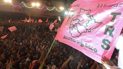 Indian supporters hold flags and shout slogans to celebrate the creation of India's 29th state, Telangana, in Hyderabad. Noah Seelam / AFP Photo