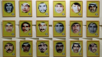 Portraits of some of around 605 missing people who were abducted by Iraqi forces line the walls of a memorial in Kuwait City. Reuters