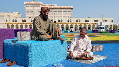 Vendors wait for shoppers at the Carpet Market at Zayed Port, Abu Dhabi. Victor Besa / The National