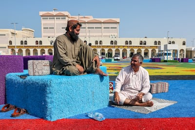Traders wait for customers at the Mina Zayed Carpet Market, in Abu Dhabi. Victor Besa / The National