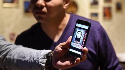 Amir Ganiev, age 27, looks at a picture of the Uzbek suspect in the deadly truck attack while working in an Uzbek restaurant in the borough of Brooklyn in New York, November 1, 2017. REUTERS/Stephanie Keith