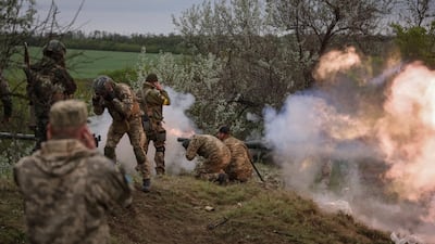 Ukrainian servicemen of the Territorial Defence Forces fire an anti-tank grenade launcher as they take part in a training exercise in Dnipropetrovsk. Reuters