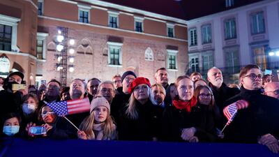 People listen as the US president delivers his speech about the Russian invasion of Ukraine. AP
