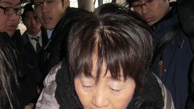 This photo, taken on March 13, 2014, shows Japanese woman Chisako Kakehi, who was arrested on suspicion of poisoning her husband with cyanide in the latest "Black Widow" case, arriving at the Kyoto district court. Jiji Press / AFP