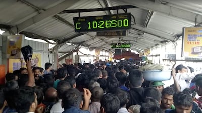 Crowds of commuters are seen moving along the Elphinstone railway station bridge around the time of a stampede. TUSHAR SADAKE / via Reuters