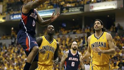 The Eastern Conference play-offs have provided the bigger shocks so far, such as Jeff Teague, left, and the Atlanta Hawks win over the Indiana Pacers. Steve C Mitchell / EPA