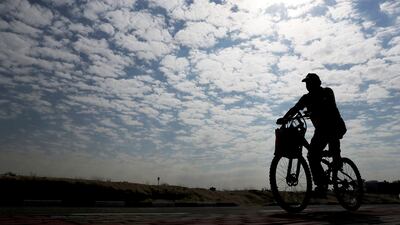 Wednesday will be partly cloudy today, with a chance of rain in Dubai. Pawan Singh / The National.