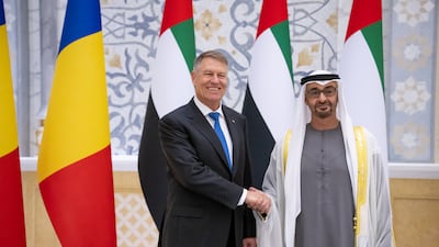 President Sheikh Mohamed and Klaus Iohannis, President of Romania, at a reception at Qasr Al Watan in Abu Dhabi. Hamad Al Kaabi / UAE Presidential Court
