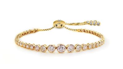 Quentin bracelet in yellow gold with round brilliant-cut stones in a bezel setting from Carat London; Dh950