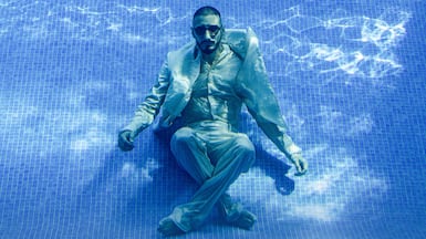 Mohamed Faisal Mostafa wears a shirt, double-breasted jacket and trousers by Fendi. Watch and sunglasses, Mohamed’s own. Chris Whiteoak / The National