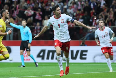 Robert Lewandowski of Poland celebrates after scoring in the Uefa Nations League match against Romania in Warsaw. EPA