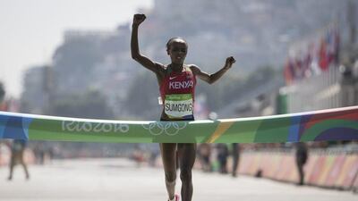 Jemima Jelagat Sumgong, of Kenya, celebrates as she crosses the finish line to win the gold medal in the marathon at the 2016 Summer Olympics in Rio de Janeiro, Brazil, Sunday, August 14, 2016. Felipe Dana / AP Photo