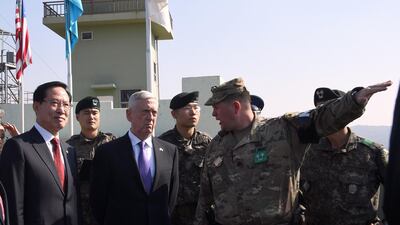 The US secretary of defence Jim Mattis and South Korean defence minister Song Young-moo, left, visit Observation Post Ouellette in the Demilitarized Zone (DMZ) between North and South Korea on October 27, 2017. Jung Yeon-je / AFP