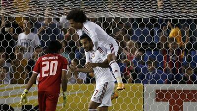 Ali Mabkhout, centre, celebrates his Asian Cup-leading fifth goal against Iraq in the 3rd/4th place playoff. Edgar Su / Reuters